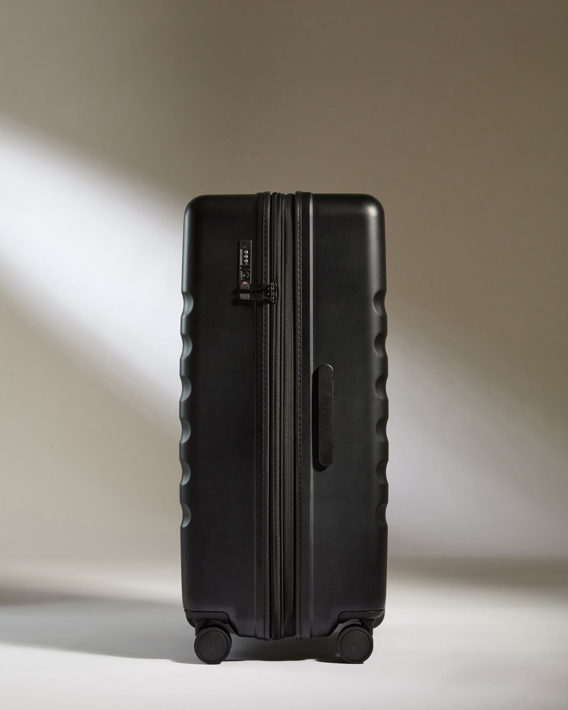 Antler Luggage -  Icon Stripe Large in Black - Hard Suitcase Icon Stripe Large Suitcase in Black | Lightweight & Hard Shell Suitcase