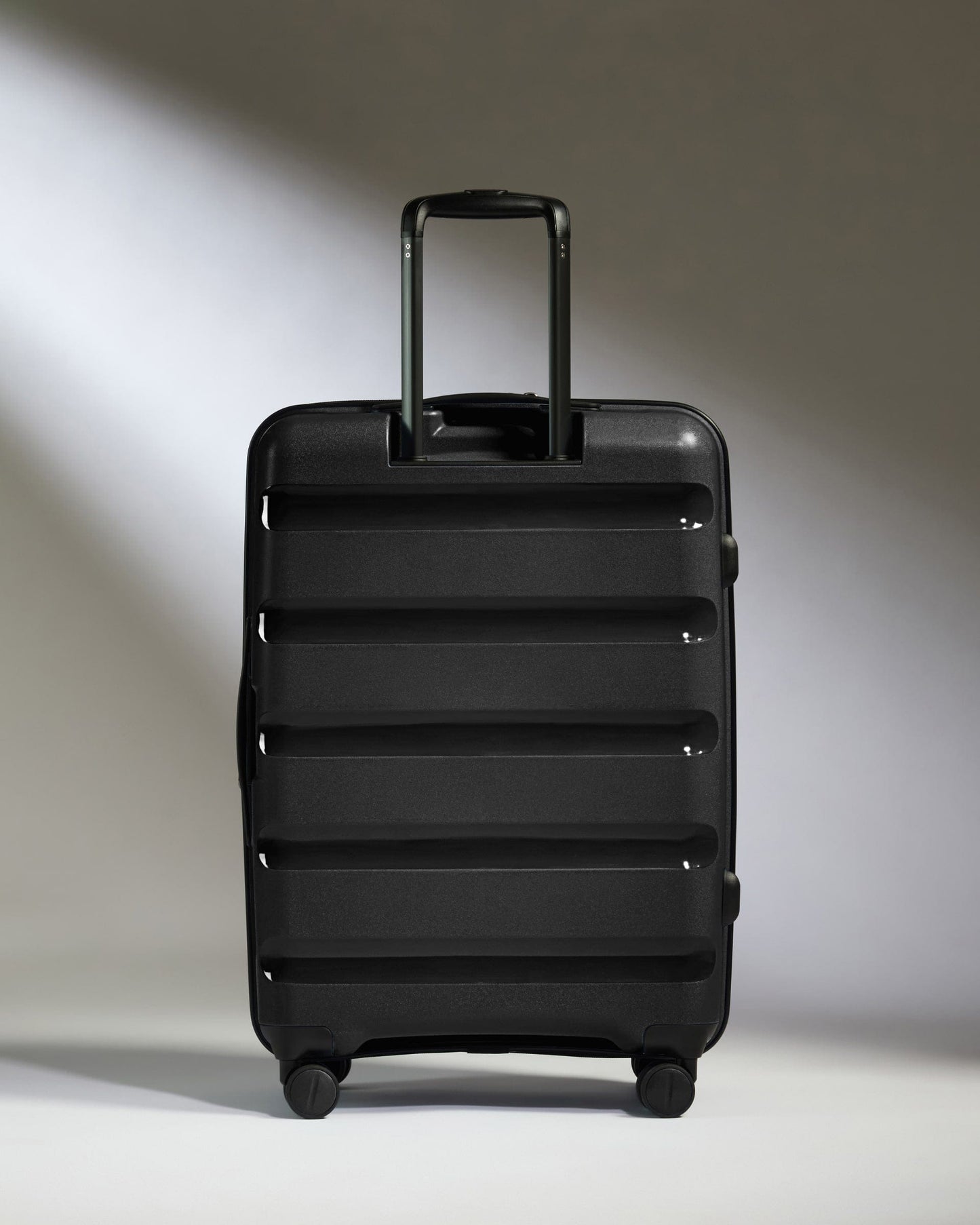 Antler Luggage - Medium Suitcase in Black - Logo Stripe - Hard Suitcase - Medium Medium Suitcase Black - Logo Stripe | Lightweight Hard Shell Luggage
