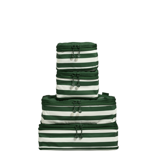 a stack of green and white striped bags