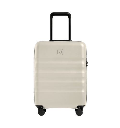 a white suitcase with black wheels