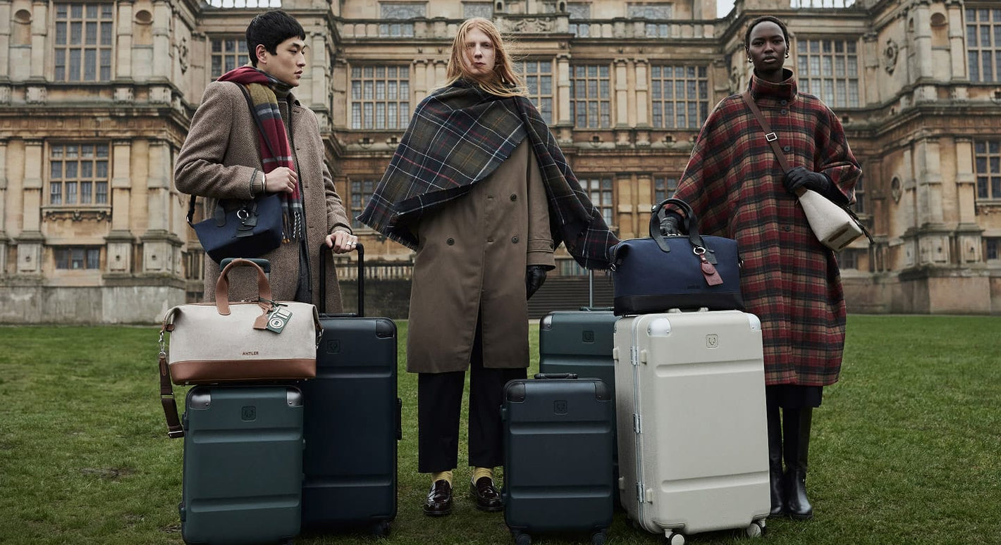 a group of people standing with luggage