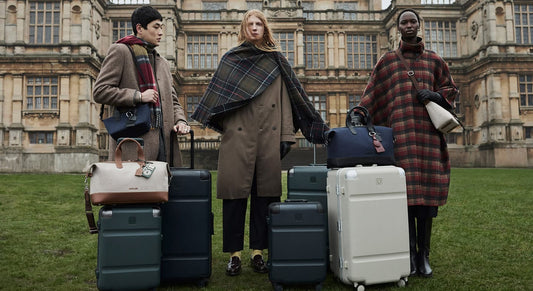 a group of people standing with luggage
