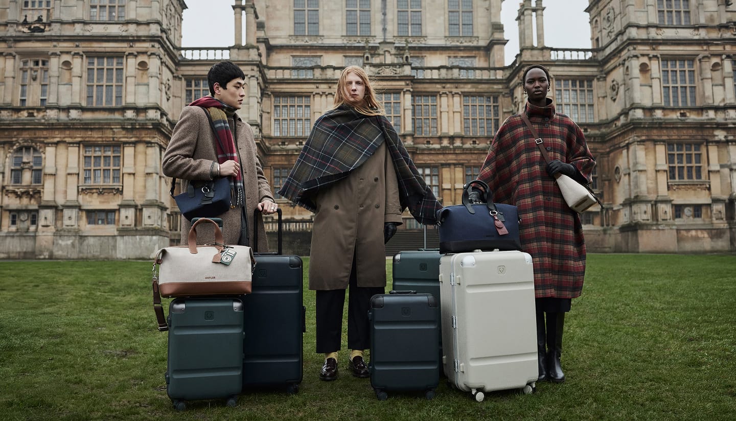 a group of people standing with luggage