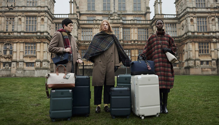 a group of people standing with luggage
