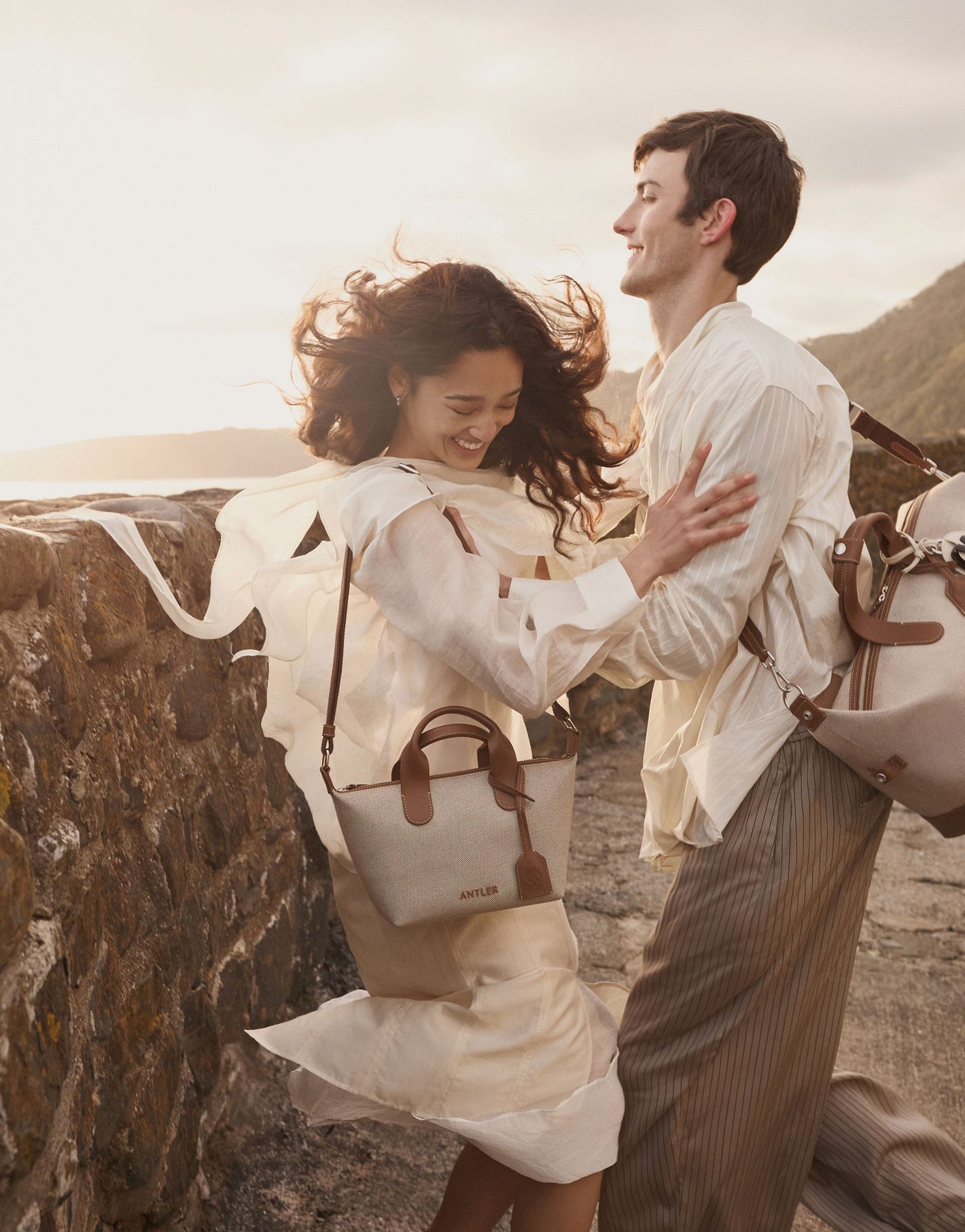 a man and woman holding each other