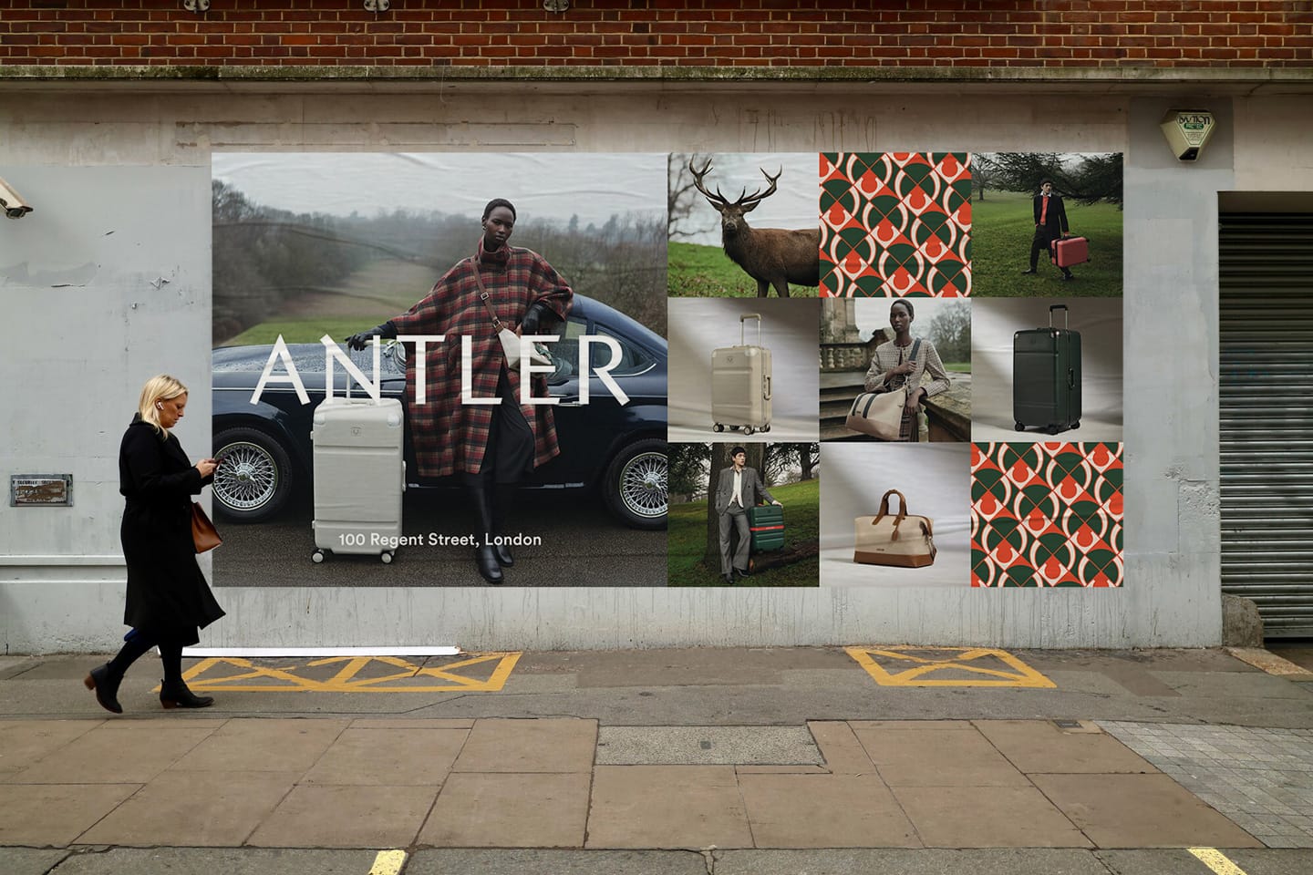 a man walking past a poster on a wall