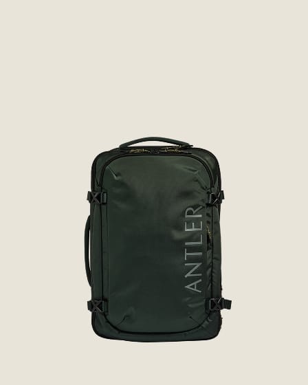 a green suitcase with a handle