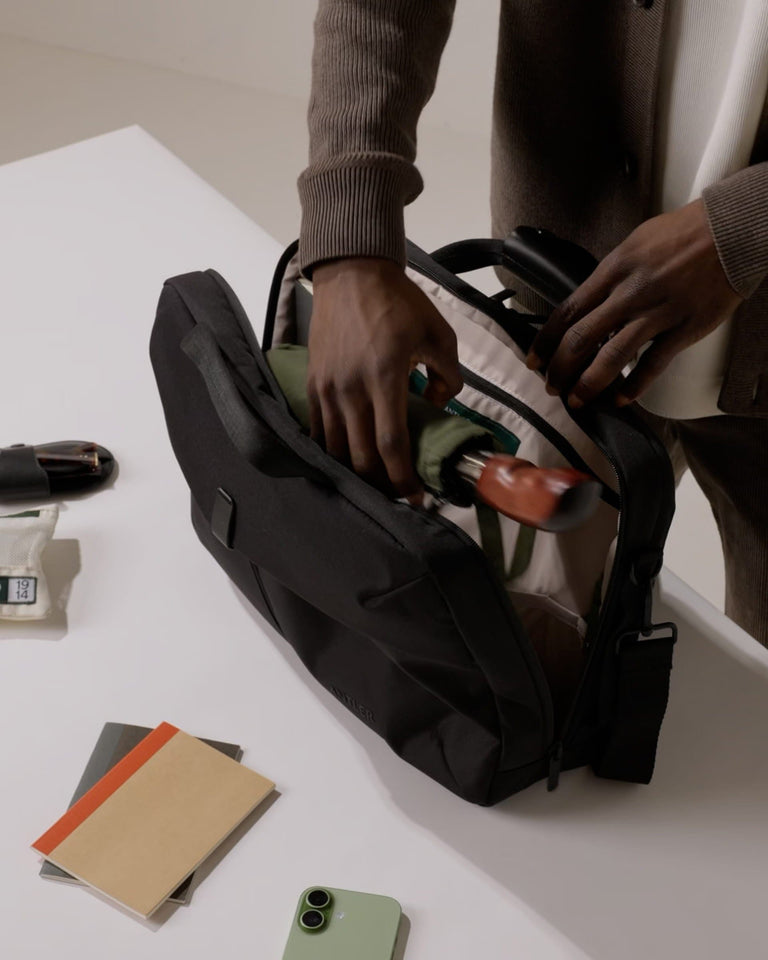 a person opening a bag