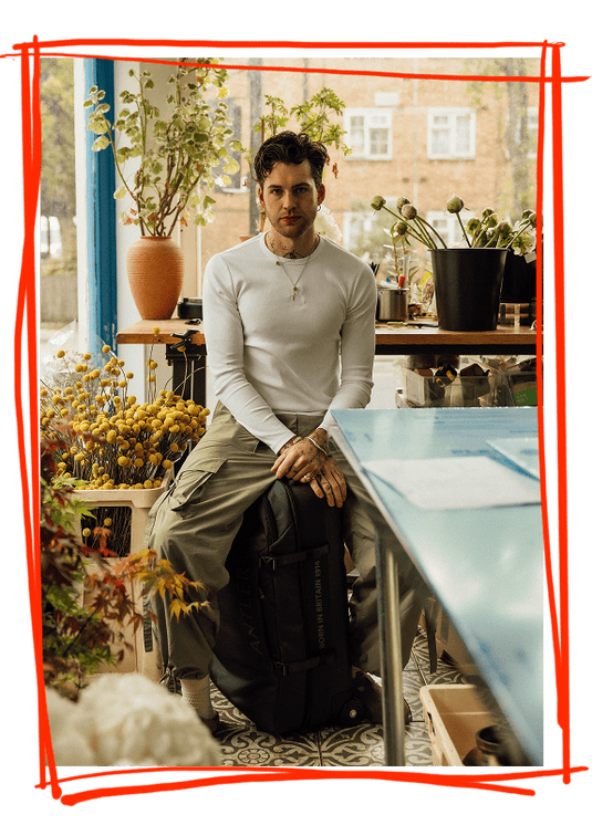 a man sitting on a bag