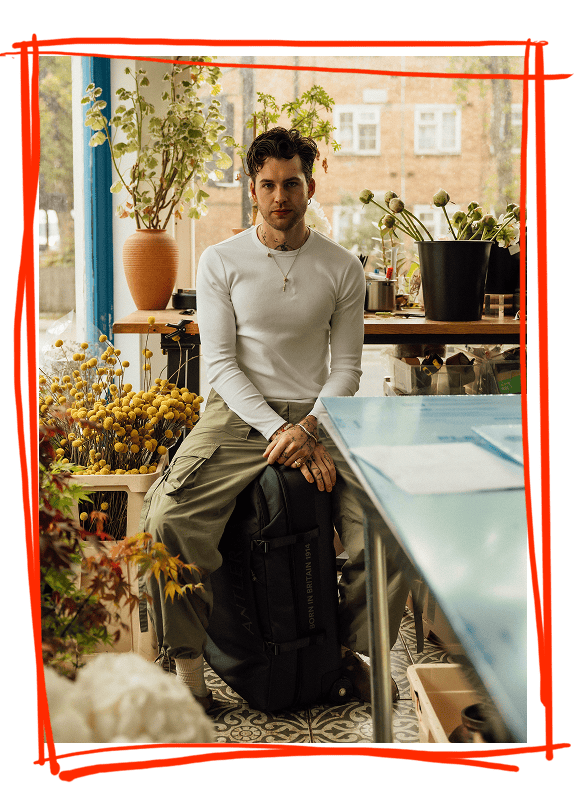 a man sitting on a bag