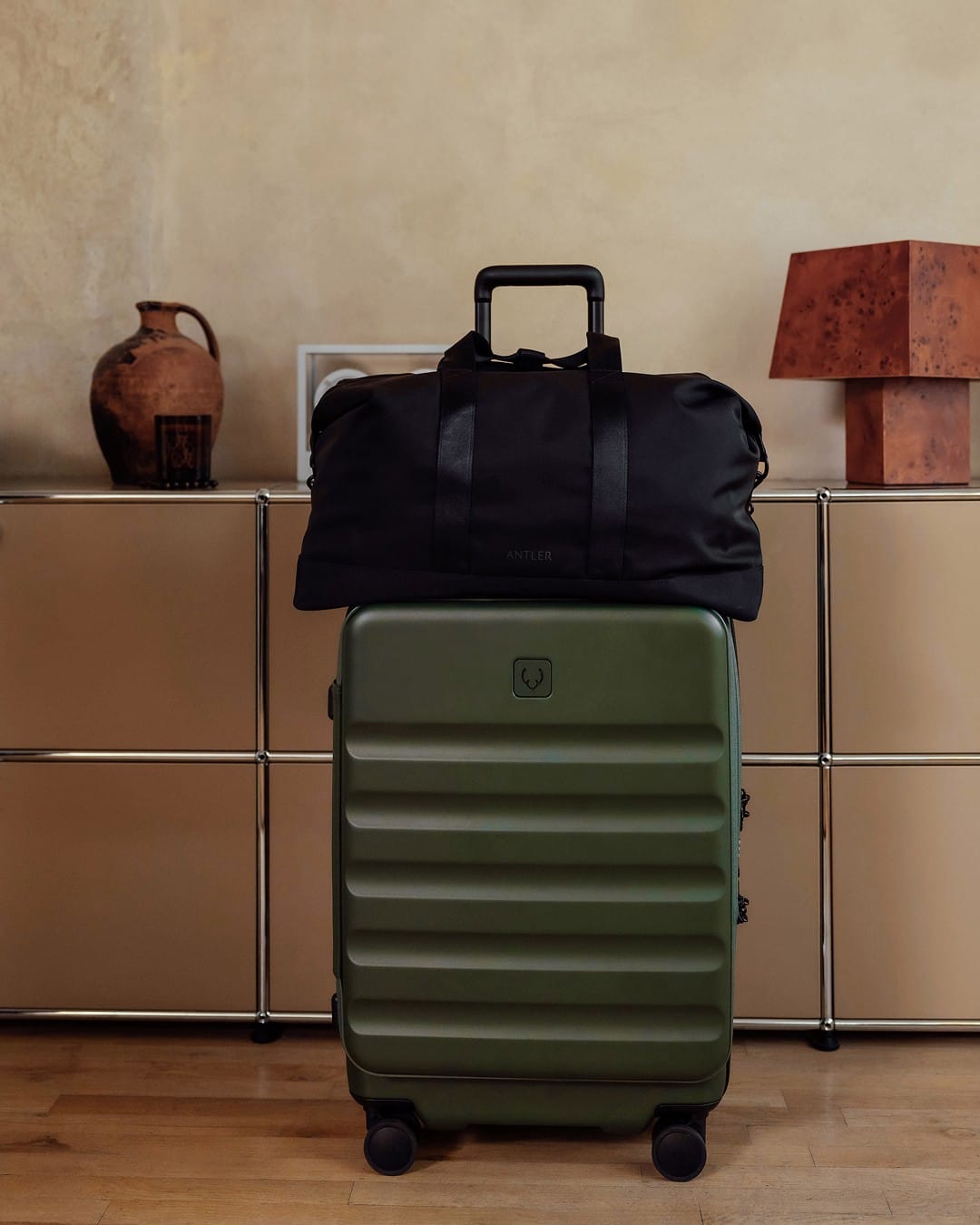 a suitcase on top of a cabinet