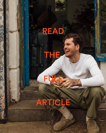 a man sitting on steps laughing