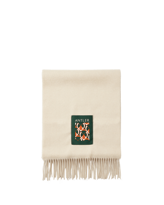 a white scarf with fringe