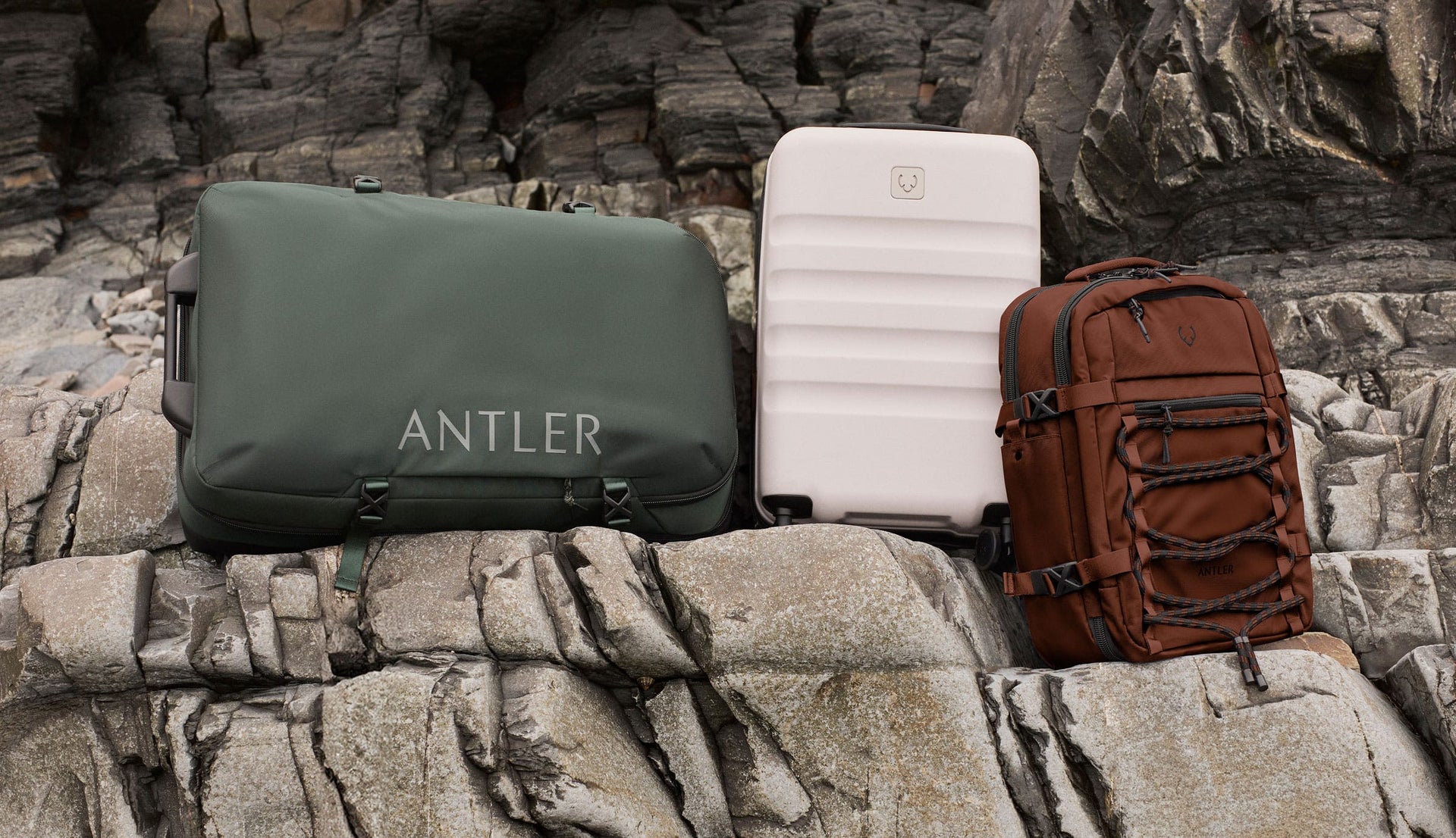 a group of luggage on a rock