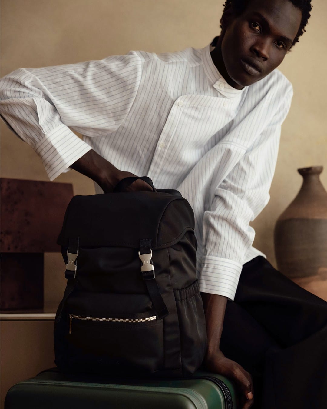 a man holding a backpack