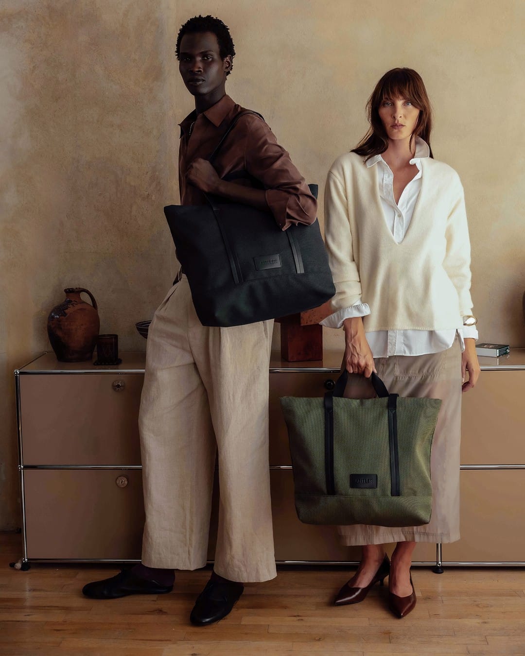 a man and woman holding bags
