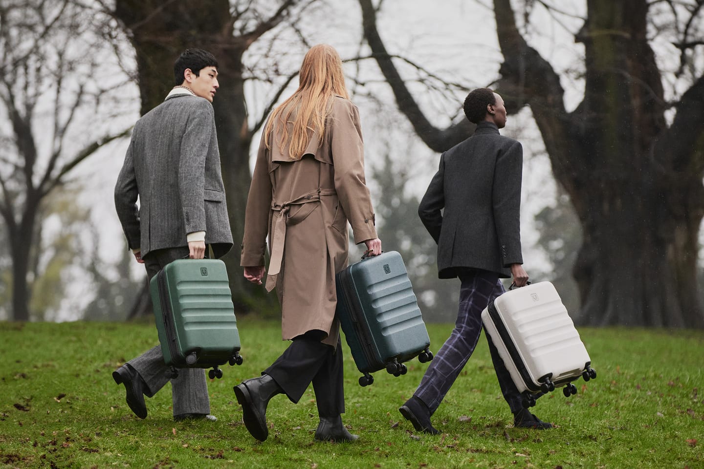 a group of people walking with luggage