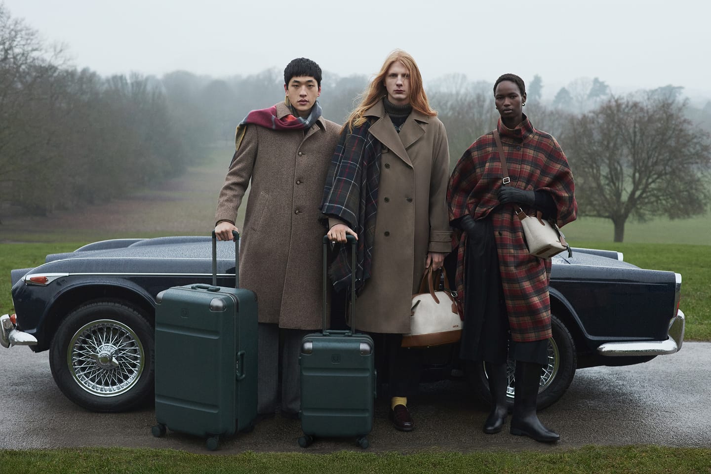 a group of people standing with luggage