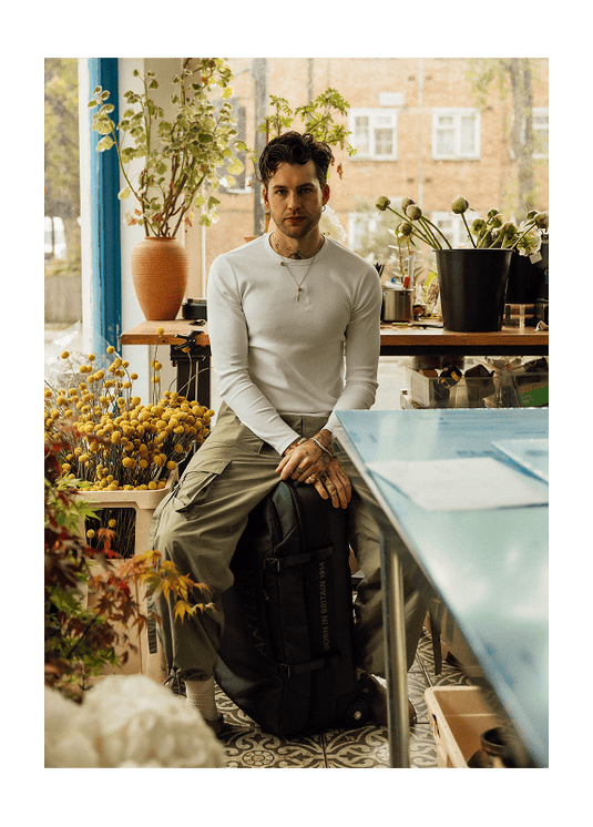 a man sitting on a suitcase