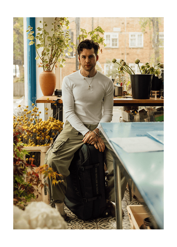 a man sitting on a suitcase
