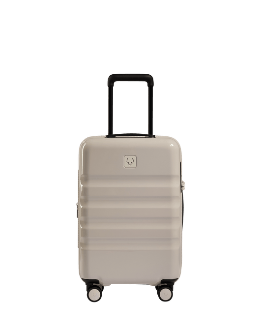 a white suitcase with black wheels