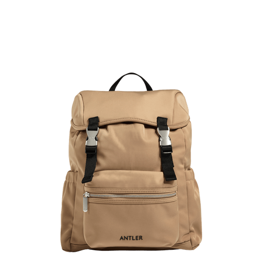 a tan backpack with black straps
