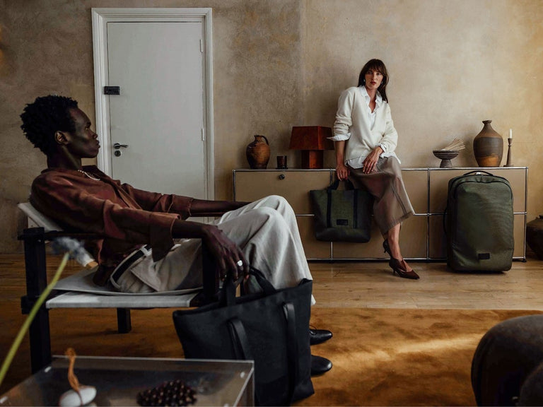 a man and woman sitting on a couch