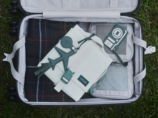 a suitcase with luggage items on it