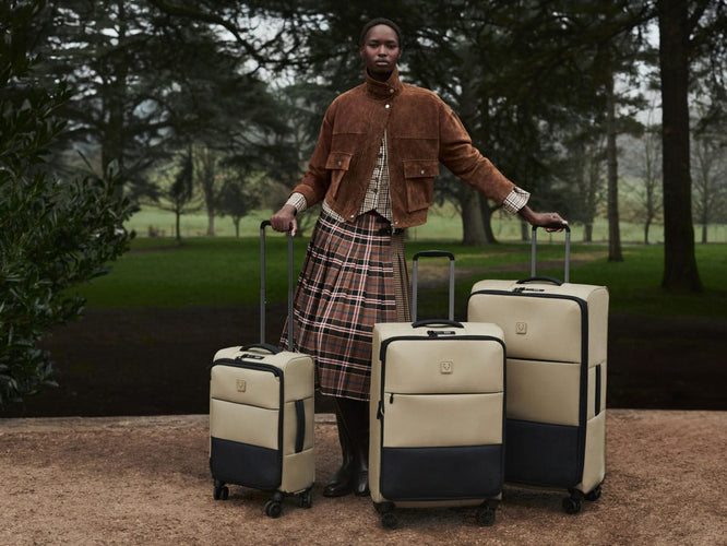 a woman standing with luggage