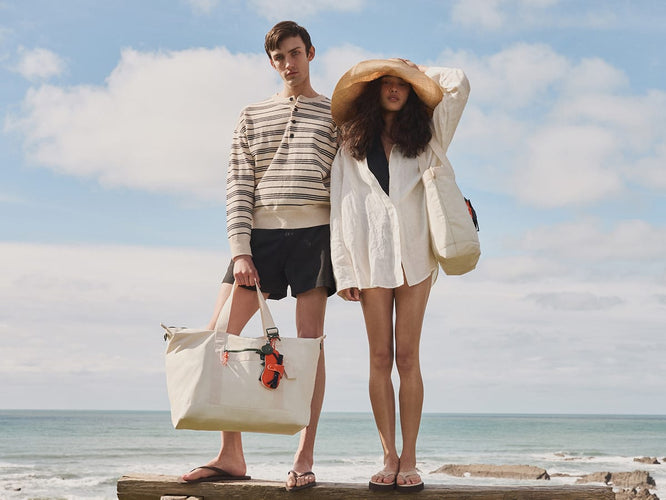 a man and woman standing on a log