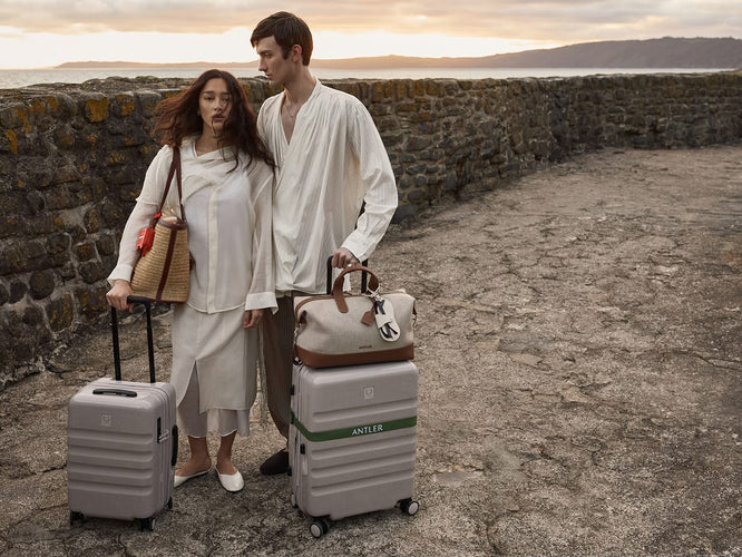 a man and woman with luggage