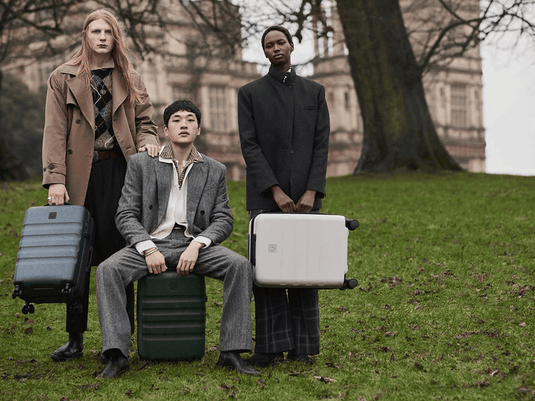 a group of people with luggage