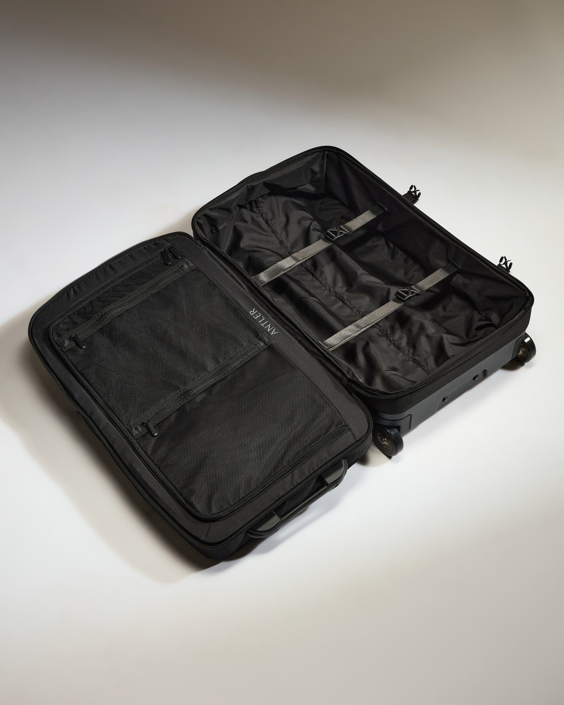 Antler Luggage -  Discovery Wheeled Duffel in Black - Wheeled Duffle Discovery Wheeled Duffel in Black | Holdall Bag & Suitcase