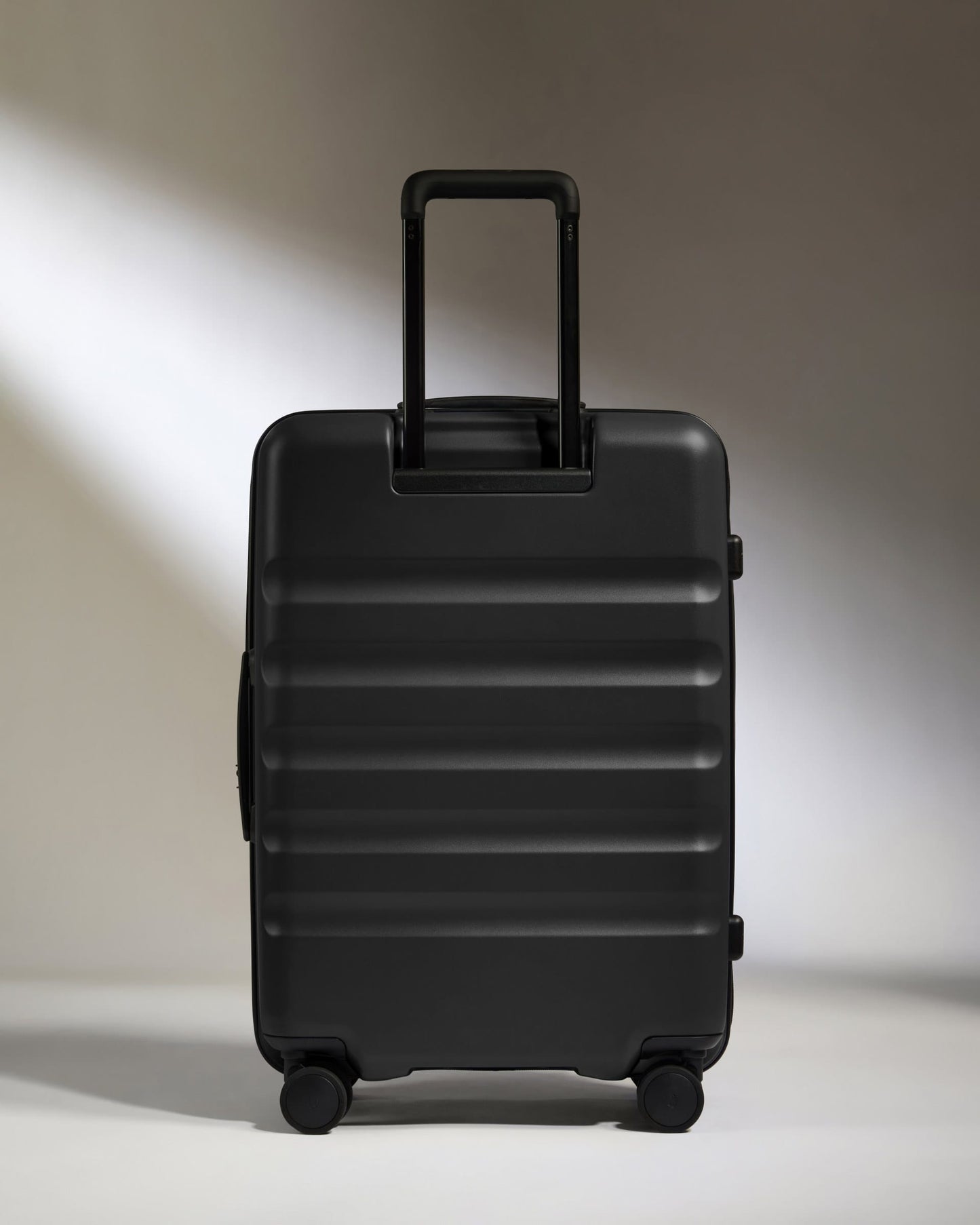 Antler Luggage -  Dual Opening Medium Suitcase in Black - Icon Stripe - Expanding Rollercase | Medium 4W Dual Opening Medium Suitcase in Black - Icon Stripe | Lightweight & Hard Shell Suitcase