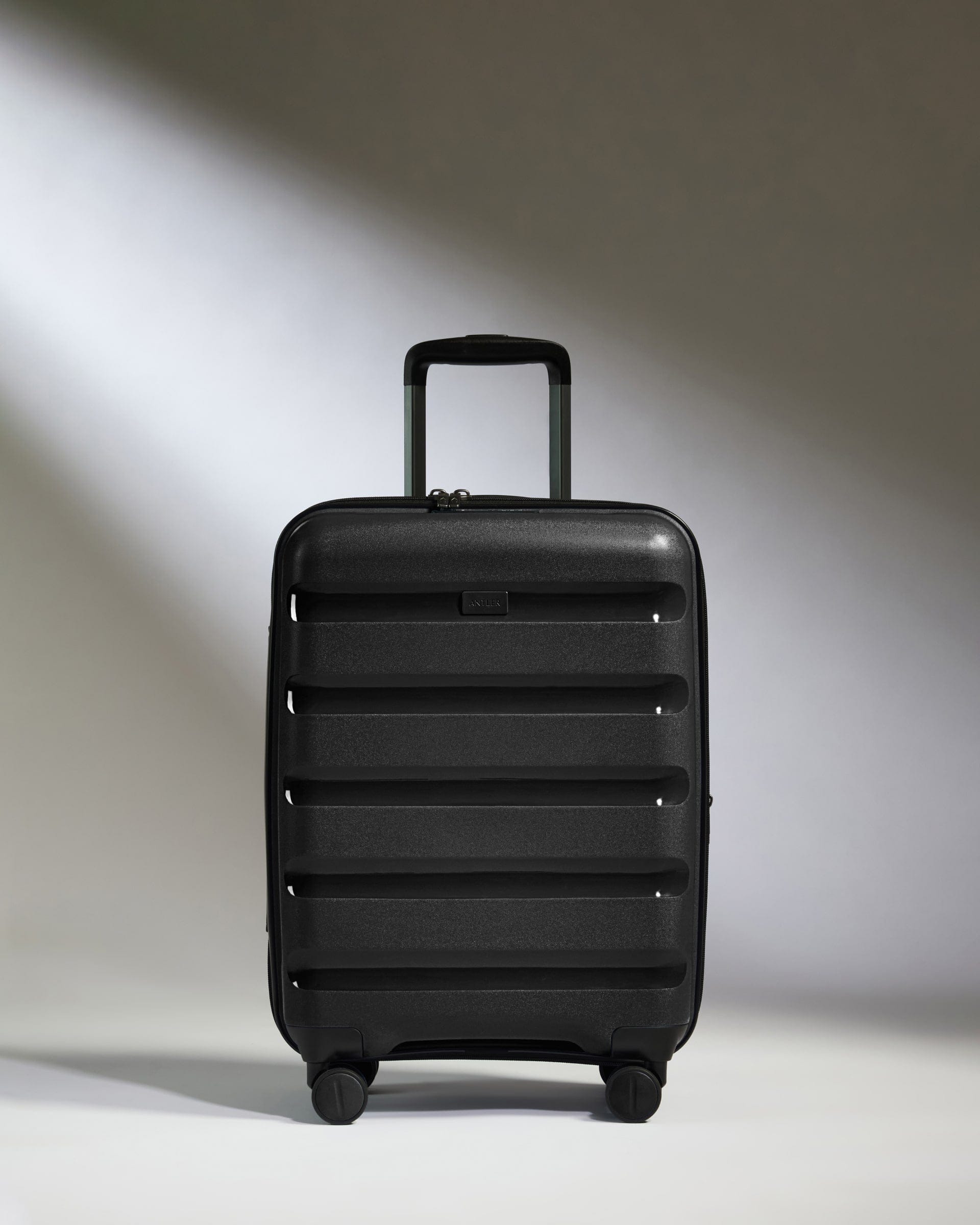 Antler Luggage -  Expandable Cabin Suitcase in Black - Logo Stripe - Hard Suitcase - Expander Cabin Expandable Cabin Suitcase Black - Logo Stripe | Lightweight Hard Shell Luggage