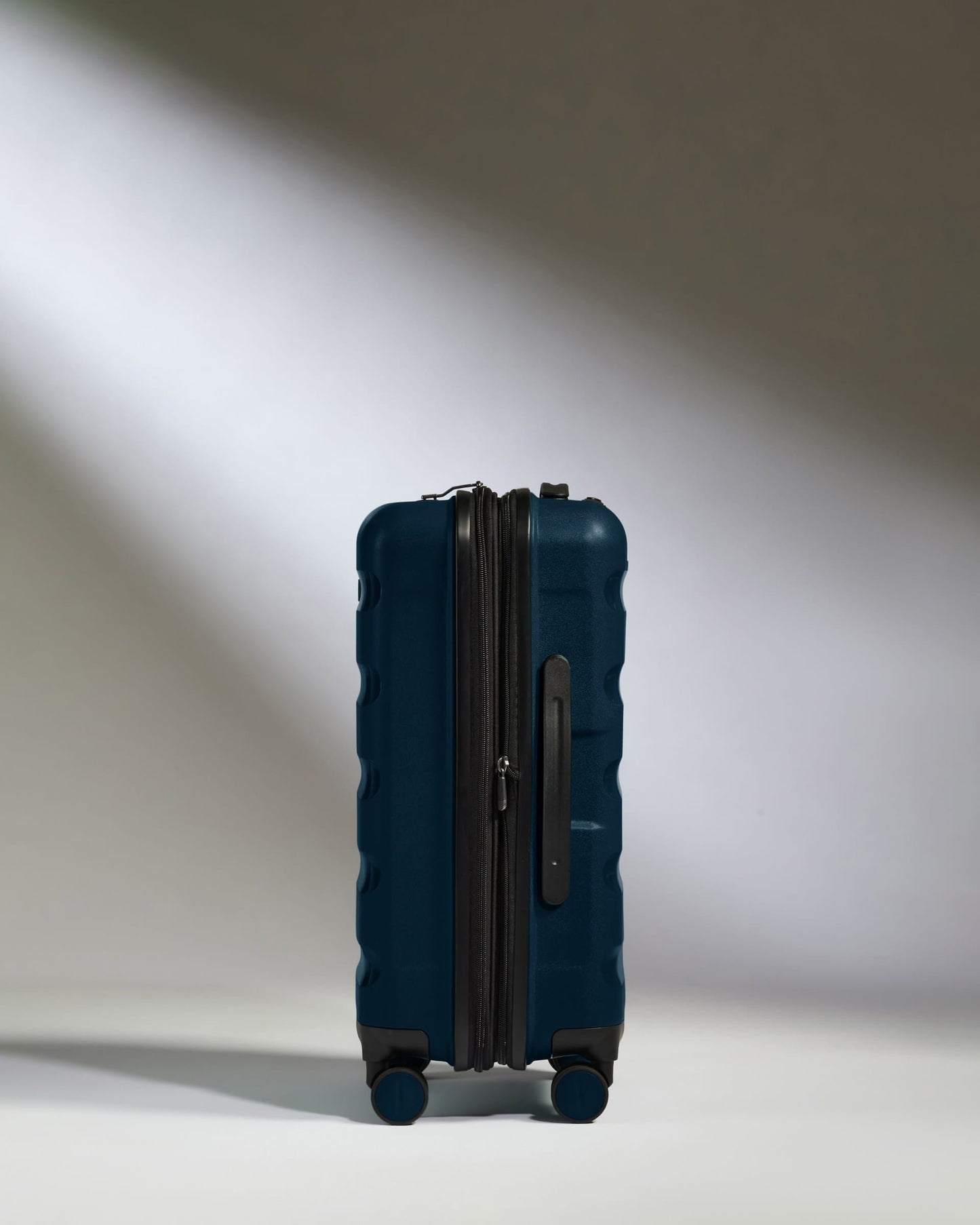 Antler Luggage -  Expandable Cabin Suitcase in Midnight Blue - Logo Stripe - Hard Suitcase - Expander Cabin Expandable Cabin Suitcase Midnight Blue - Logo Stripe | Lightweight Hard Shell Luggage