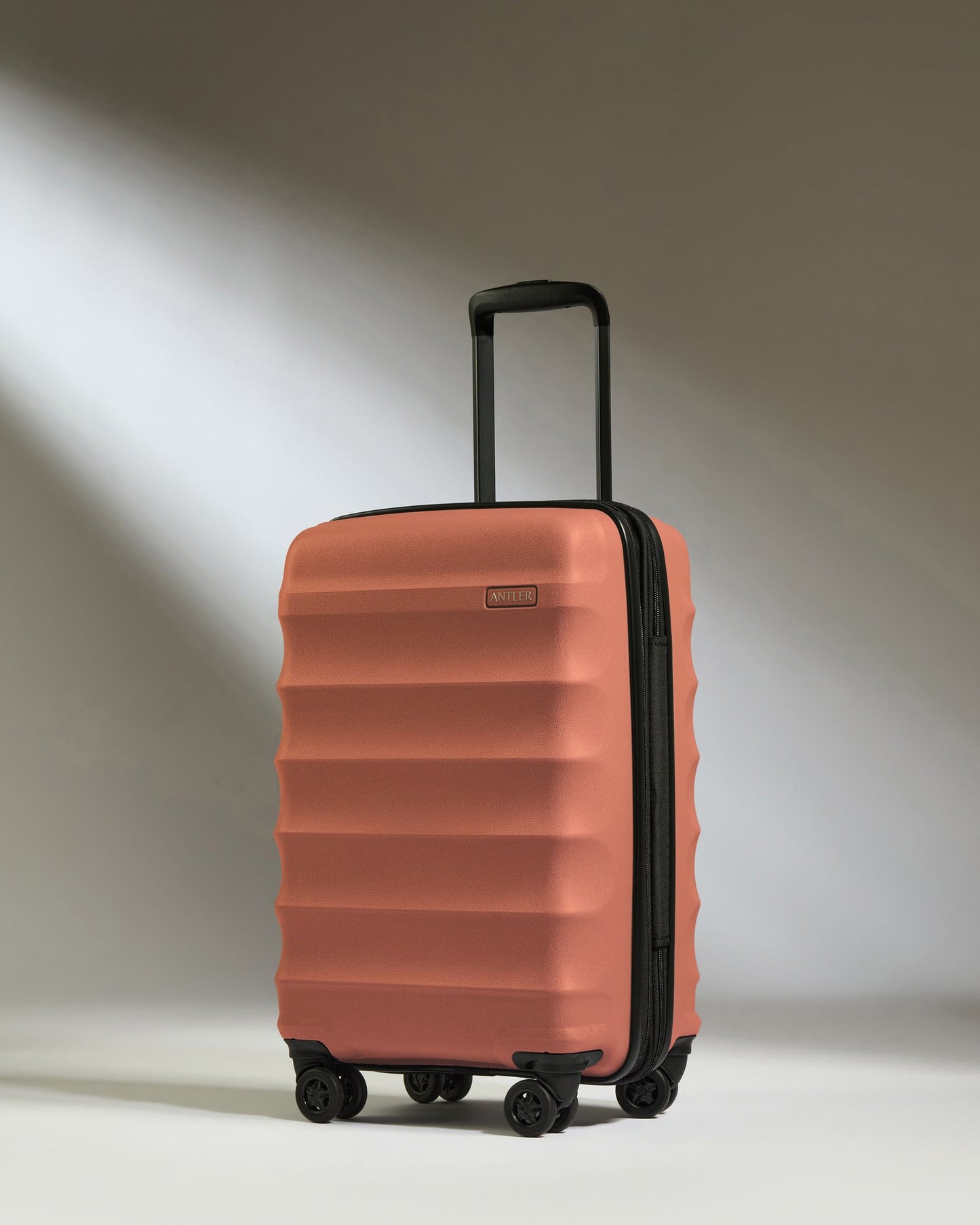 Antler Luggage -  Expandable Cabin Suitcase in Soft Orange  - Juno - Hard Suitcase - Expander Cabin Cabin Suitcase with Expander in Soft Orange - Juno | Carry-on Luggage