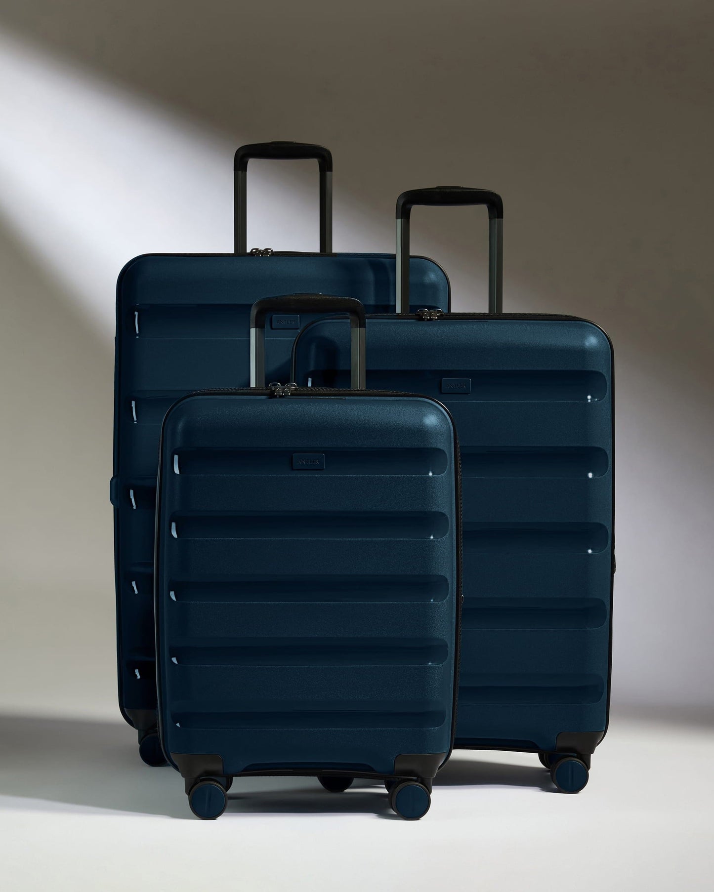 Antler Luggage -  Expandable Cabin Suitcase Set in Midnight Blue - Logo Stripe - Hard Suitcase - Expander Cabin Set Expandable Cabin Suitcase Set of 3 Midnight Blue - Logo Stripe | Lightweight Hard Shell Luggage