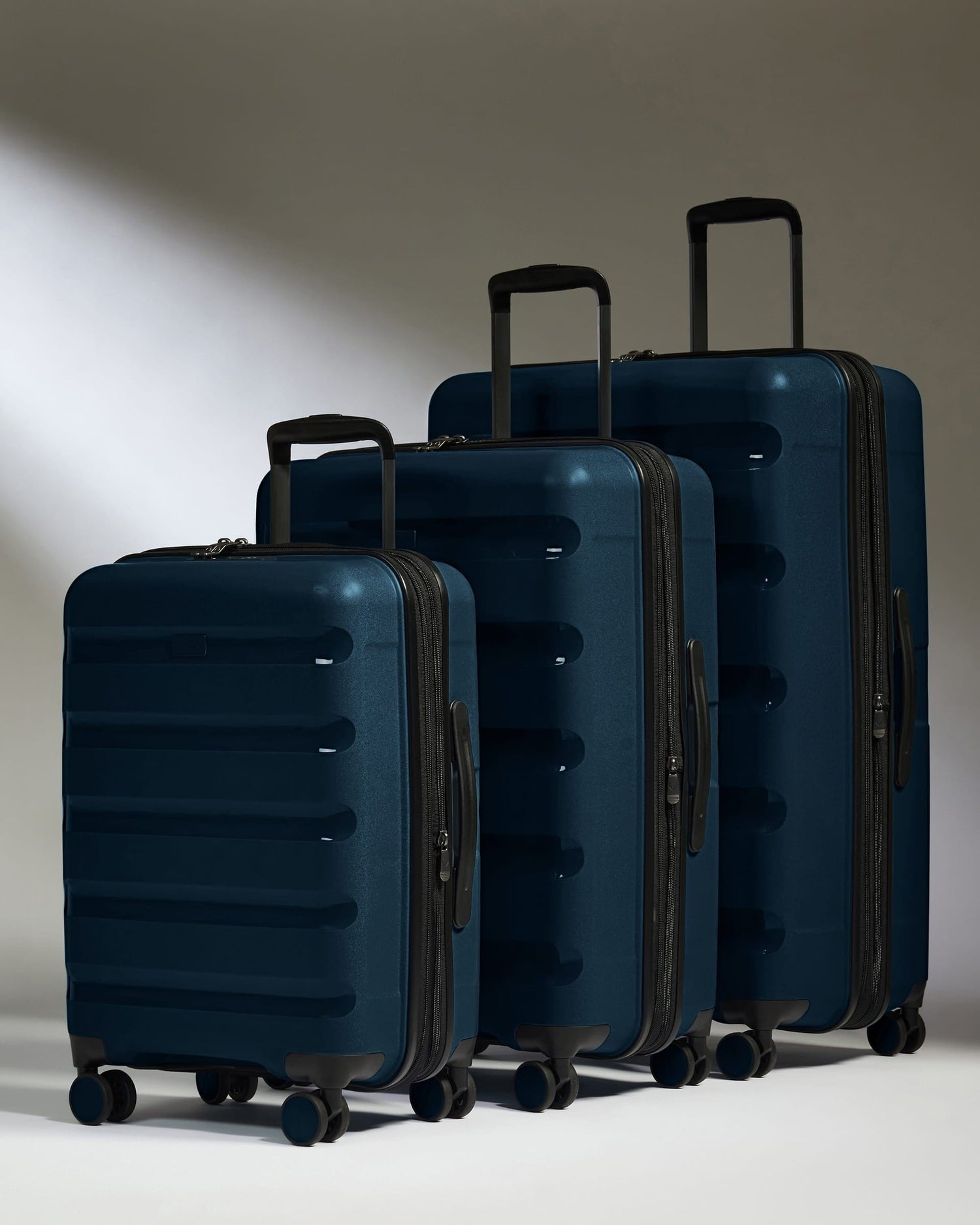 Antler Luggage -  Expandable Cabin Suitcase Set in Midnight Blue - Logo Stripe - Hard Suitcase - Expander Cabin Set Expandable Cabin Suitcase Set of 3 Midnight Blue - Logo Stripe | Lightweight Hard Shell Luggage