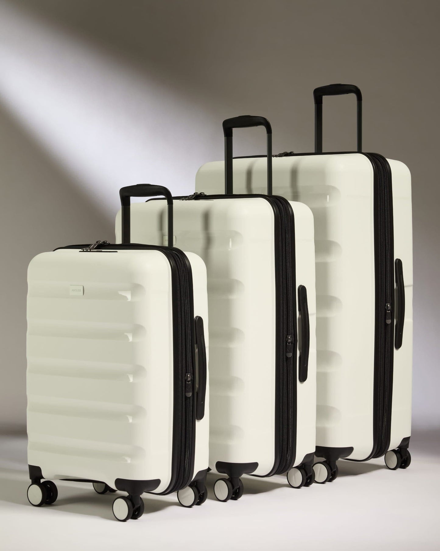 Antler Luggage -  Expandable Cabin Suitcase Set in White - Logo Stripe - Hard Suitcase - Expander Cabin Set Expander Cabin Suitcase Set of 3 Black - Logo Stripe | Lightweight Hard Shell Luggage