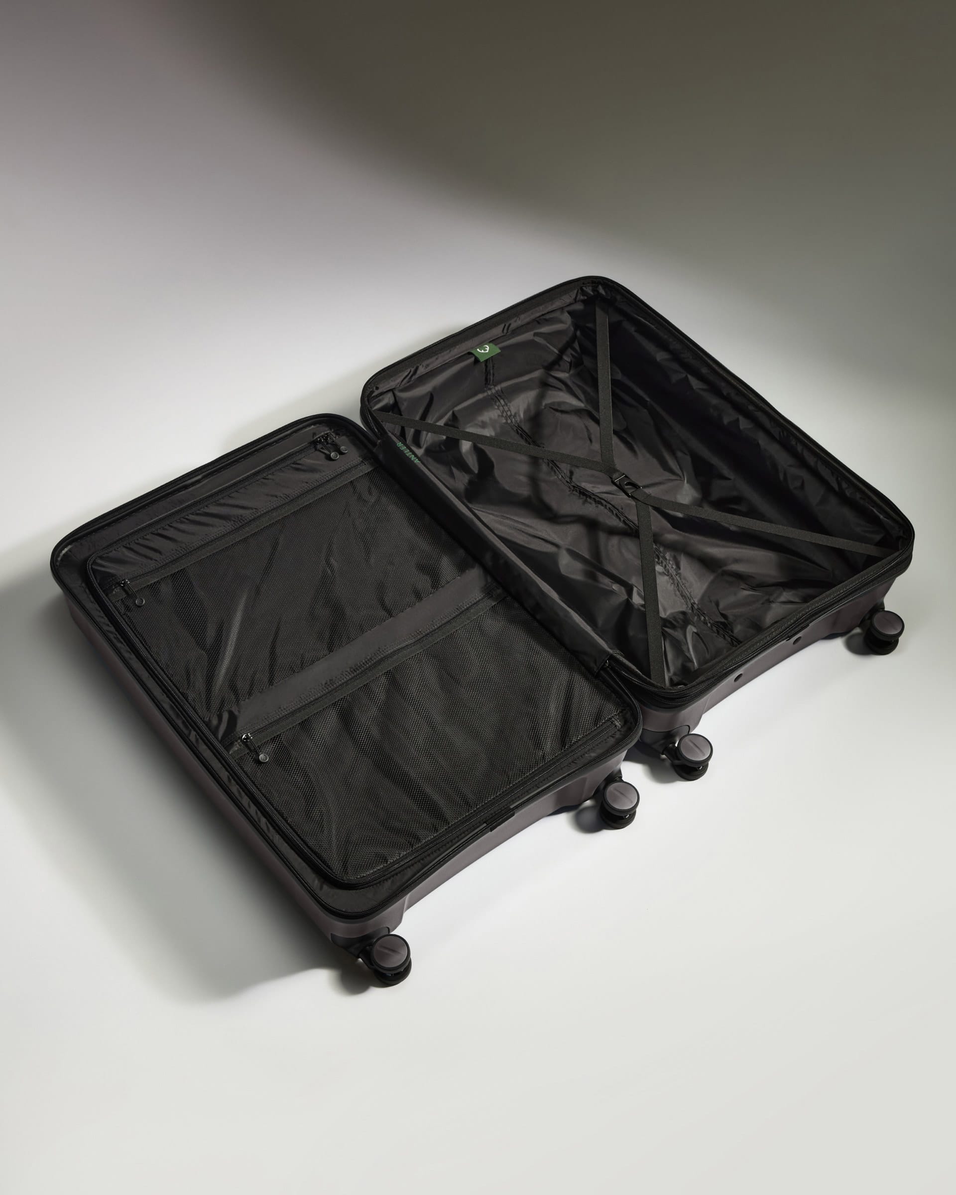 Antler Luggage -  Expandable Large Suitcase in Gloss Gull Grey - Logo Stripe - Expanding Rollercase | Large 4W Expandable Large Suitcase in Gloss Gull Grey - Logo Stripe