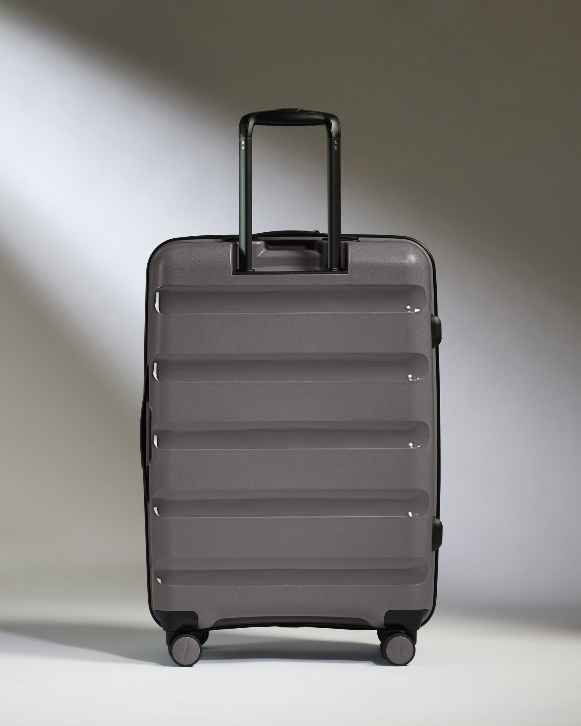 Antler Luggage -  Expandable Medium Suitcase in Gloss Gull Grey - Logo Stripe - Expanding Rollercase | Medium 4W Expandable Medium Suitcase in Gloss Gull Grey - Logo Stripe