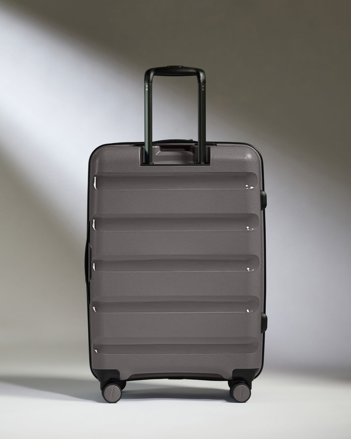 Antler Luggage -  Expandable Medium Suitcase in Gloss Gull Grey - Logo Stripe - Expanding Rollercase | Medium 4W Expandable Medium Suitcase in Gloss Gull Grey - Logo Stripe