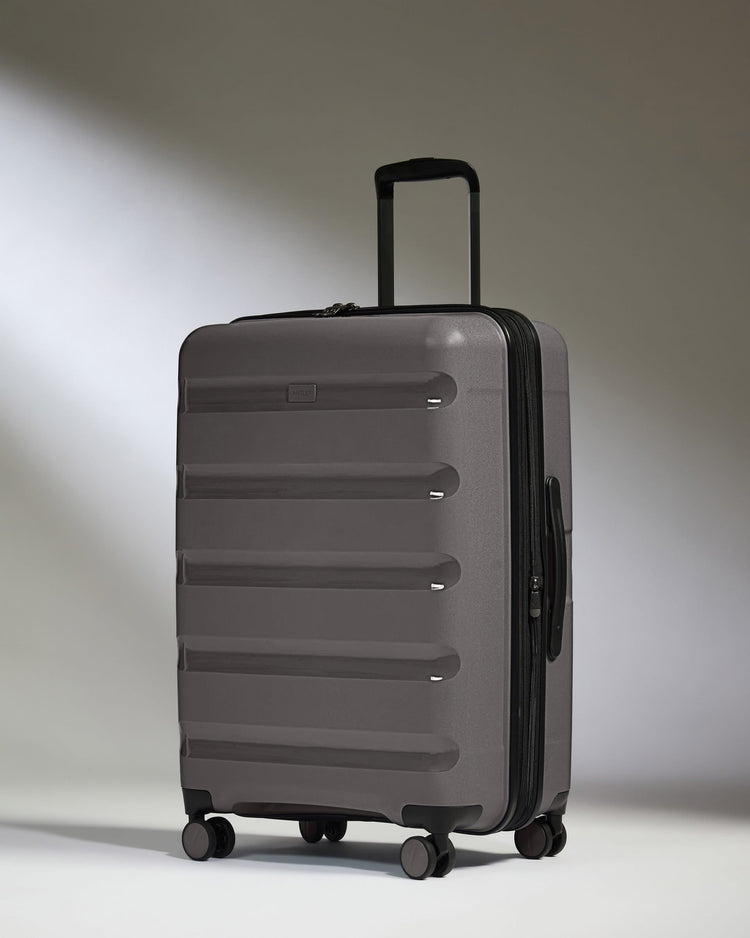Antler Luggage -  Expandable Medium Suitcase in Gloss Gull Grey - Logo Stripe - Expanding Rollercase | Medium 4W Expandable Medium Suitcase in Gloss Gull Grey - Logo Stripe