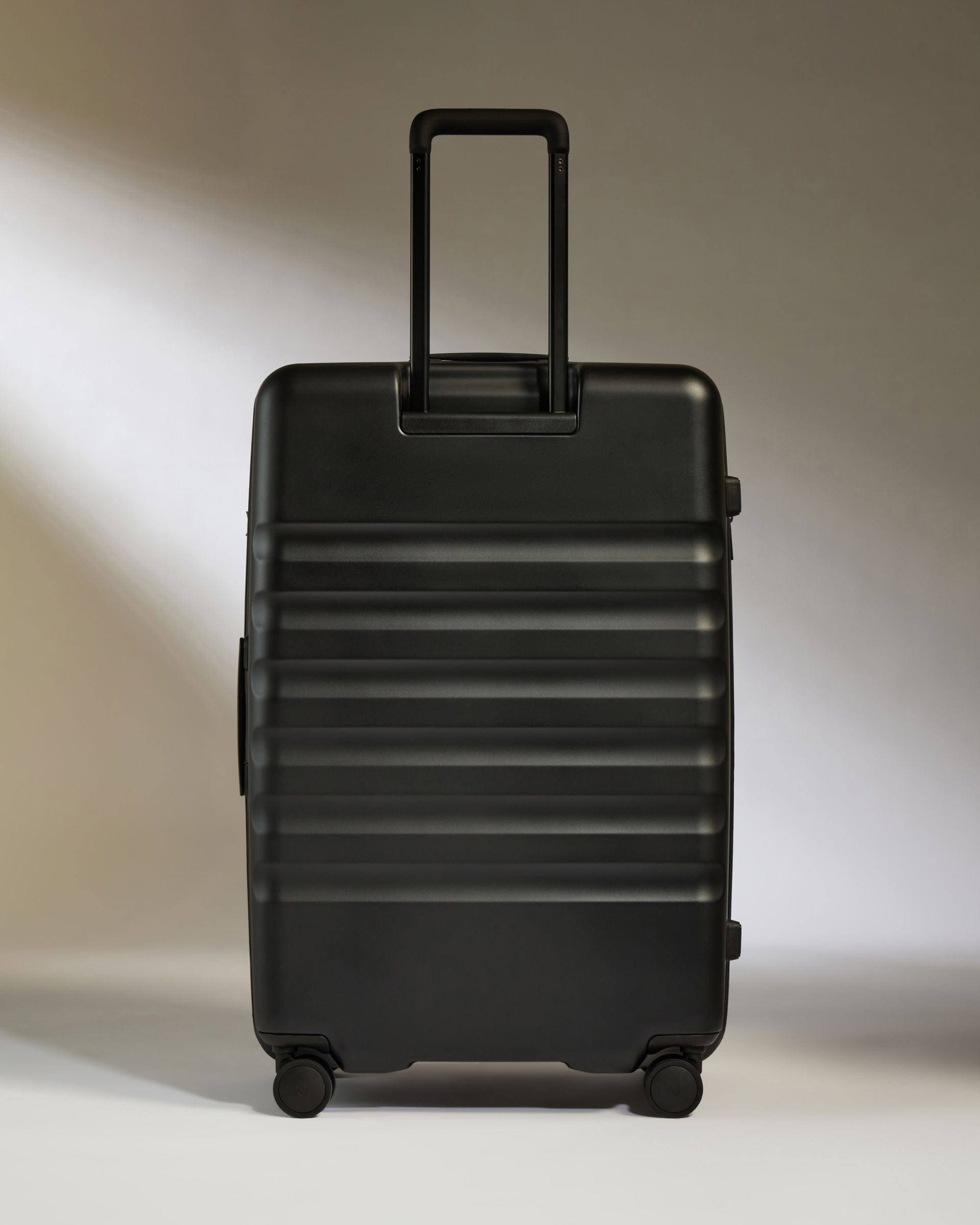 Antler Luggage -  Icon Stripe Large in Black - Hard Suitcase Icon Stripe Large Suitcase in Black | Lightweight & Hard Shell Suitcase