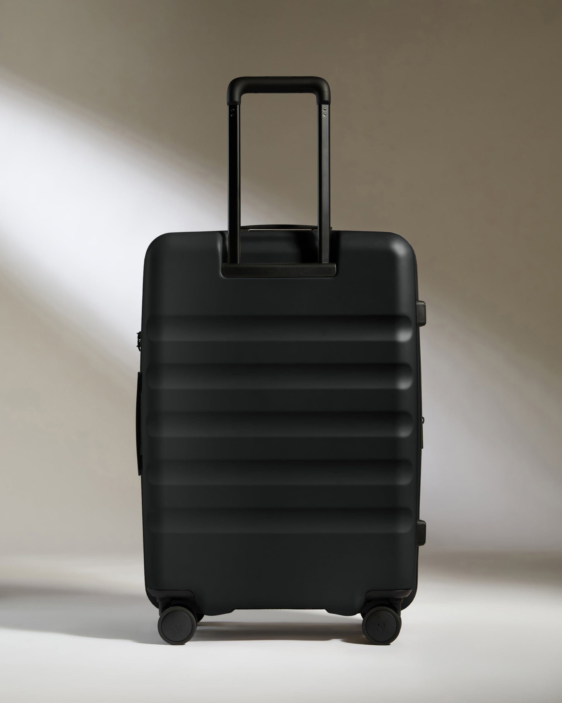 Antler Luggage -  Icon Stripe Medium in Black - Hard Suitcase Icon Stripe Medium Suitcase in Black | Lightweight & Hard Shell Suitcase