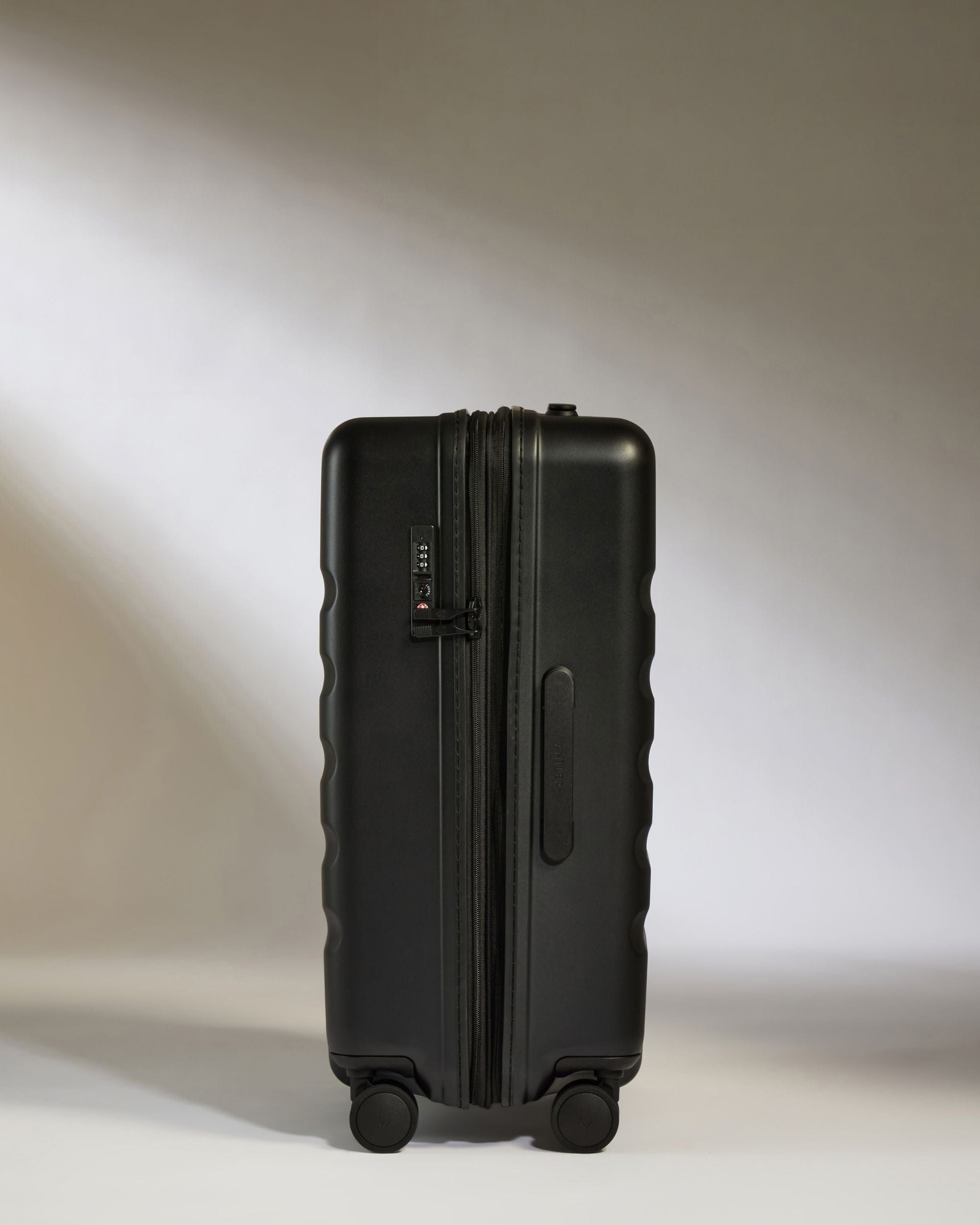 Antler Luggage -  Icon Stripe Medium in Black - Hard Suitcase Icon Stripe Medium Suitcase in Black | Lightweight & Hard Shell Suitcase