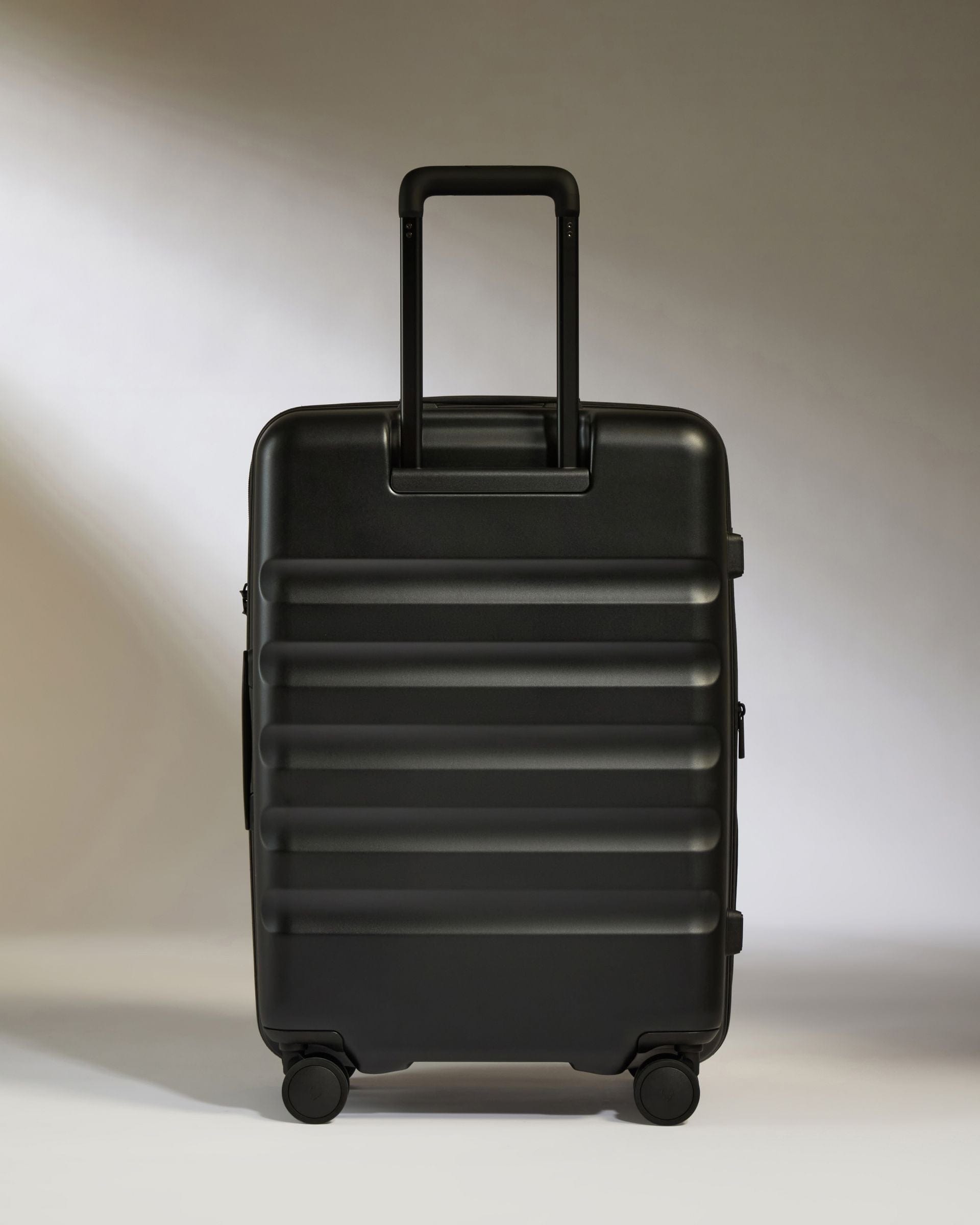 Antler Luggage -  Icon Stripe Medium in Black - Hard Suitcase Icon Stripe Medium Suitcase in Black | Lightweight & Hard Shell Suitcase