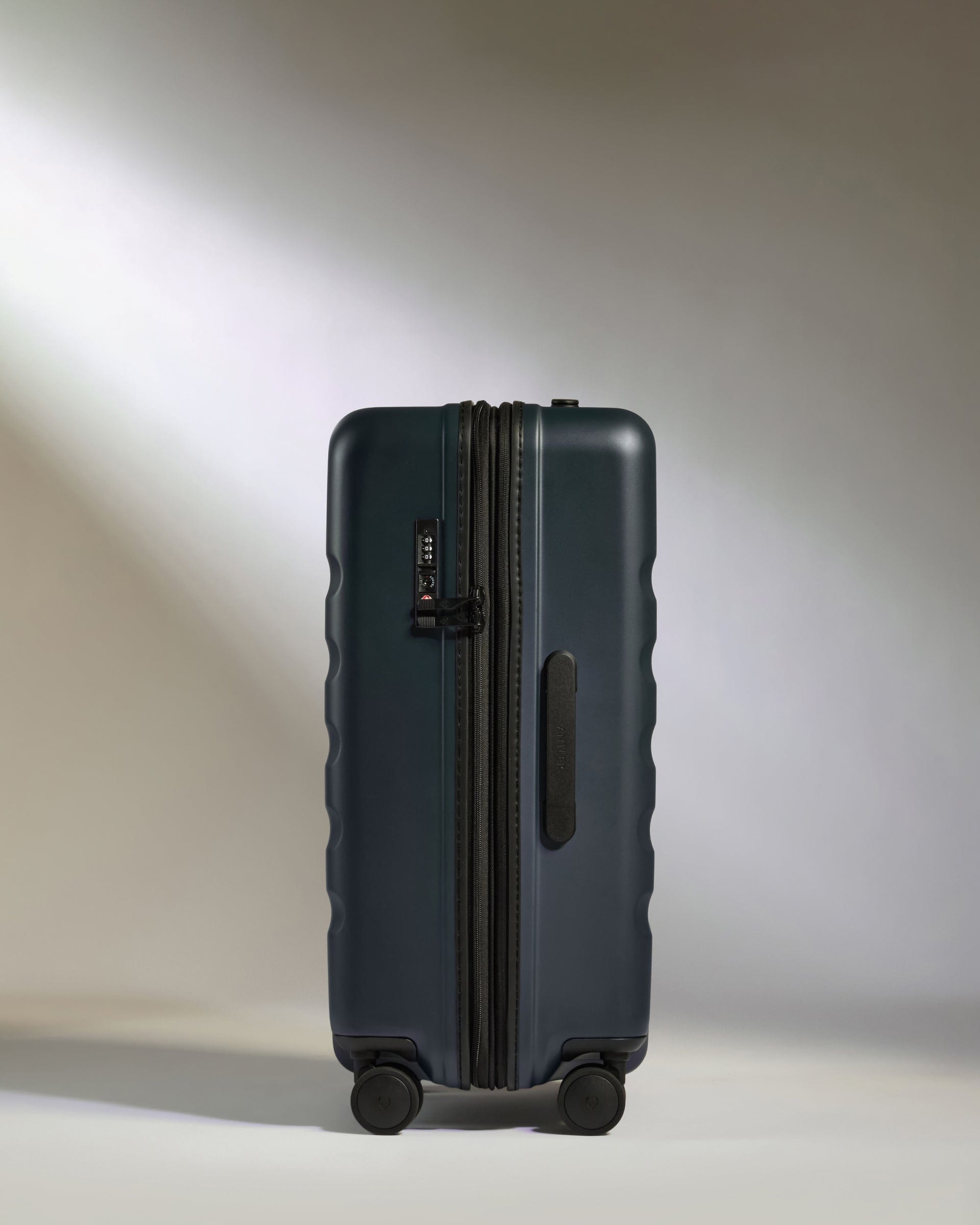 Antler Luggage -  Icon Stripe Medium in Indigo Blue - Hard Suitcase Icon Stripe Medium Suitcase in Blue | Lightweight & Hard Shell Suitcase