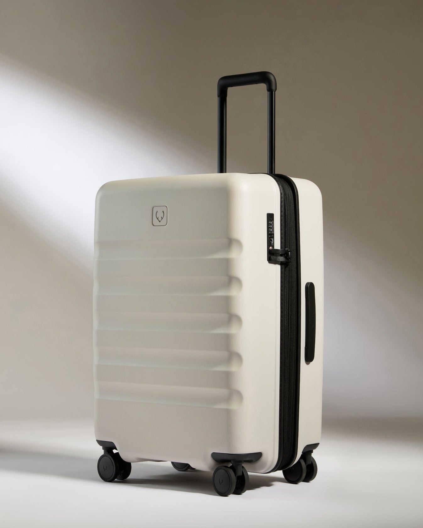 Medium suitcase in Taupe - Icon Stripe | Lightweight & Hard Shell ...